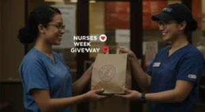 Chipotle employee giving food to smiling nurse for Nurses Week