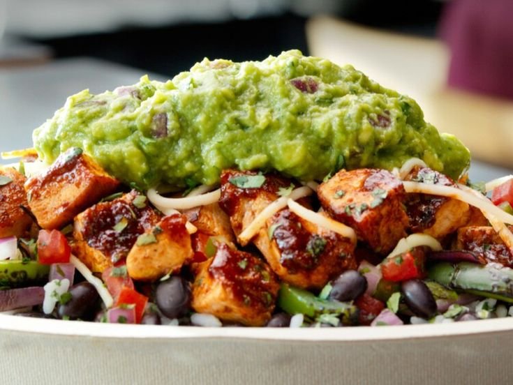 Chipotle menu items including customizable burritos, bowls, tacos, and fresh sides.